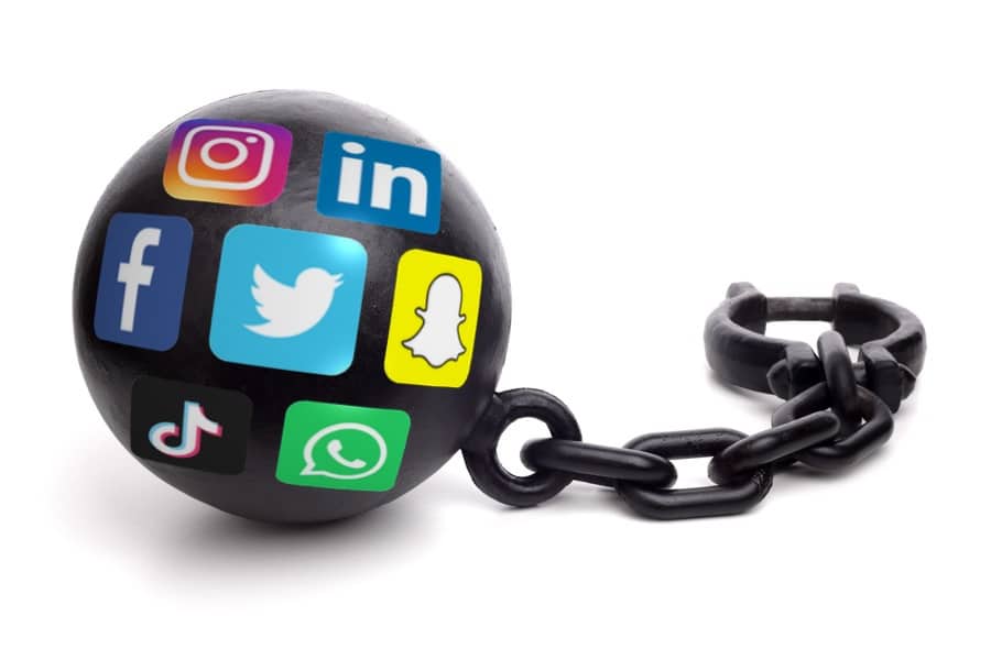 Ball and chain with social media logos isolated on a white background